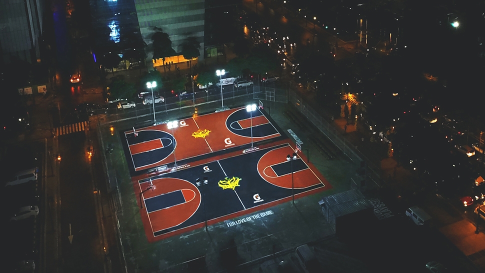outdoor basketball court at night