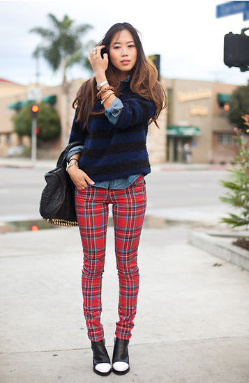 Paris France  March 5 2019 Street style  Woman wearing black white  striped jumper plaid pants and Chanel bag before a fashion show during  Pari Stock Photo  Alamy