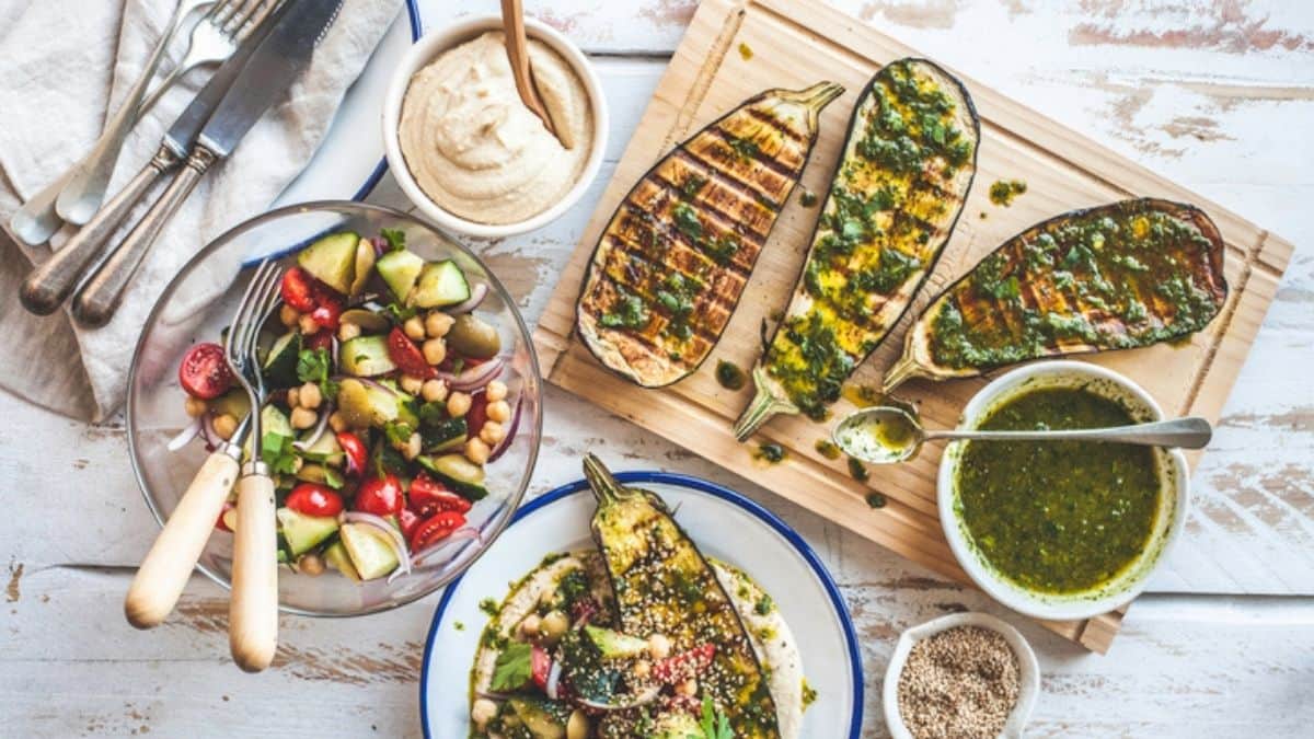 pcos diet: a spread of salads with eggplants and humus and pesto