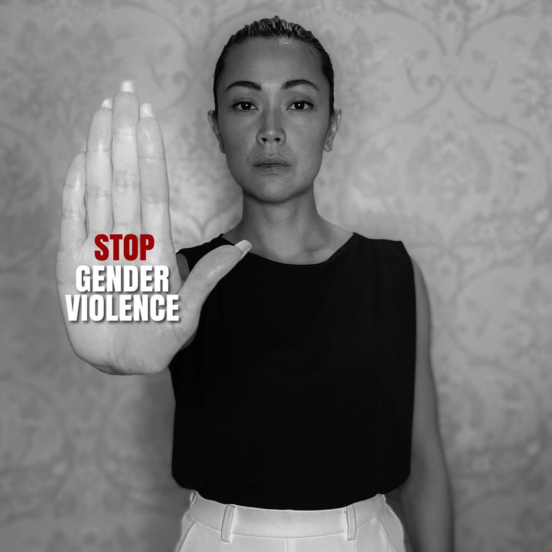 Jodi Sta. Maria holding her hand up with the words STOP GENDER VIOLENCE