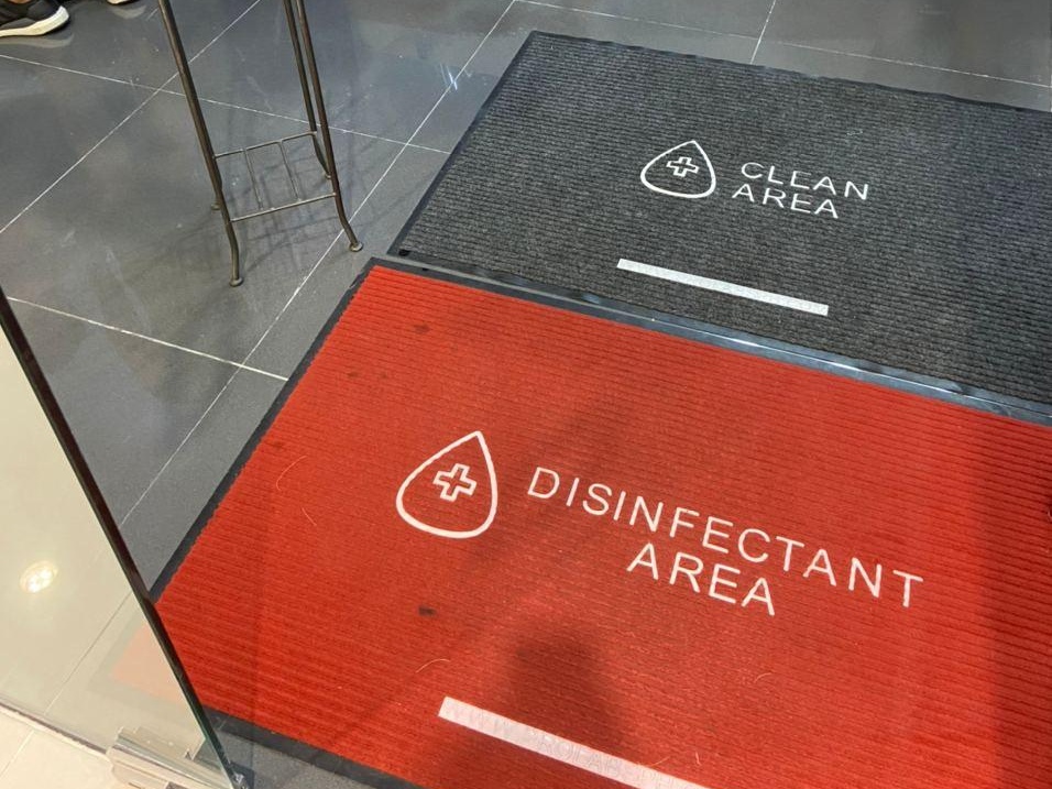 gym safety protocols - disinfecting foot mats