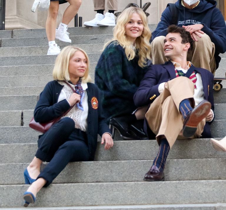 The cast of the Gossip Girl reboot, sitting on the Met steps in NYC.