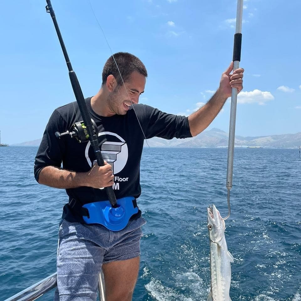 Gerald Anderson celebrating a caught fish