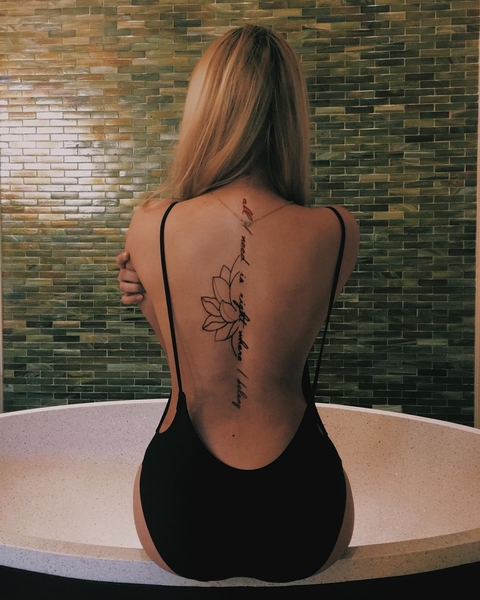 A photo of Christine Samson's back tattoos