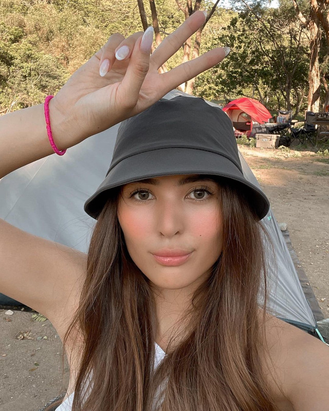 Sofia Andres wearing a bucket hat