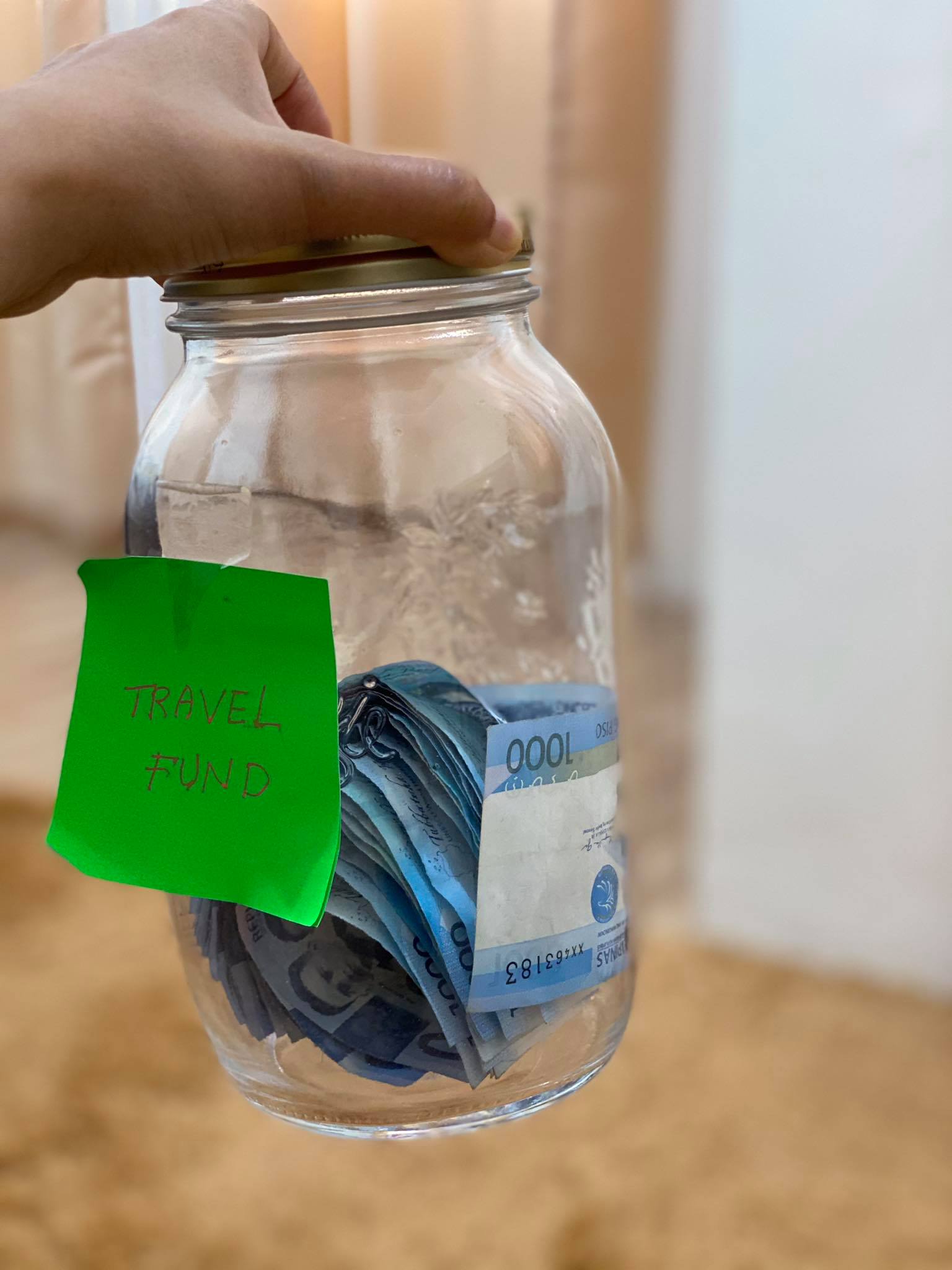 Pinoy couple sets up a travel jar with funds coming from 'budol' violations