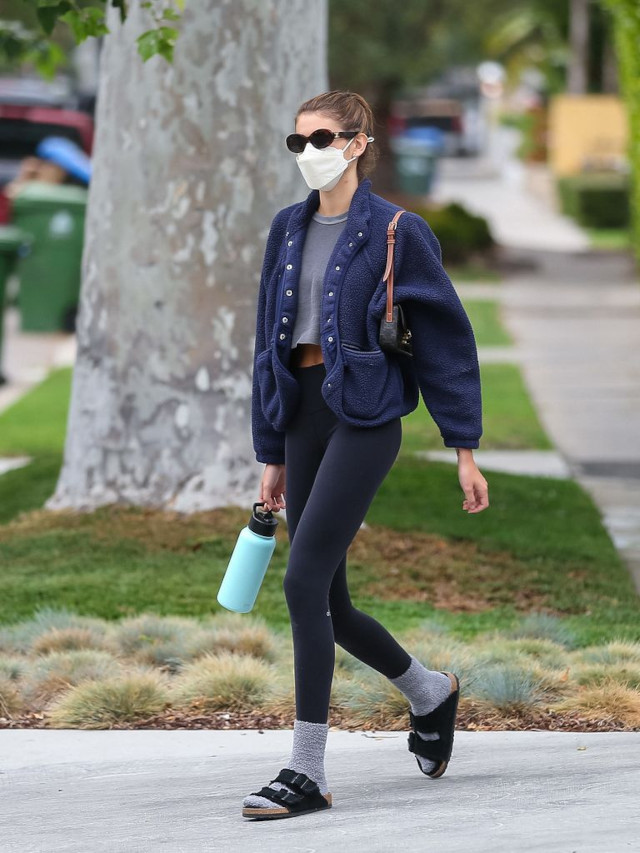 Kaia Gerber wearing socks and sandals