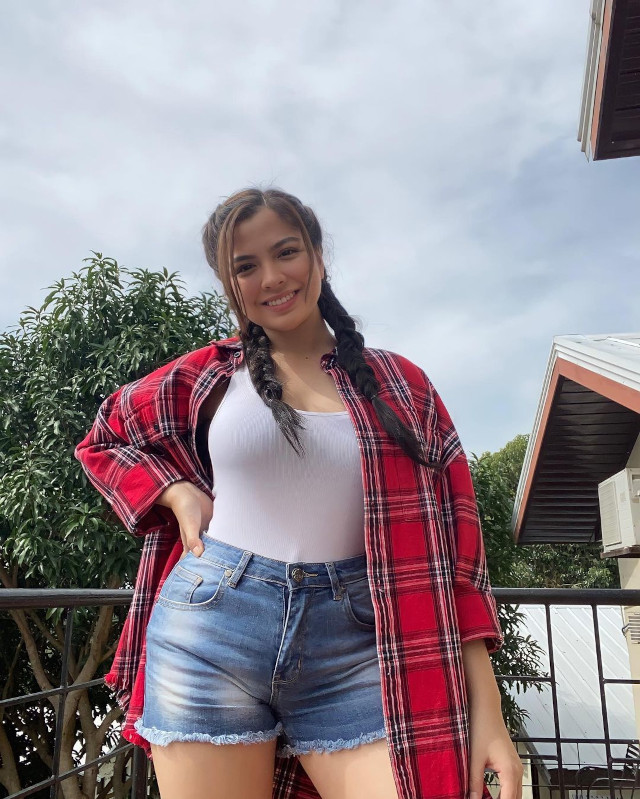 Alexa Ilacad outfit: plaid shirt, white tank, denim shorts