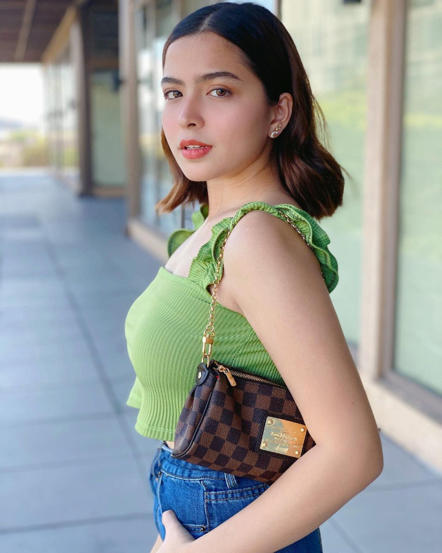 Alexa Ilacad outfit: ruffle top, baguette bag