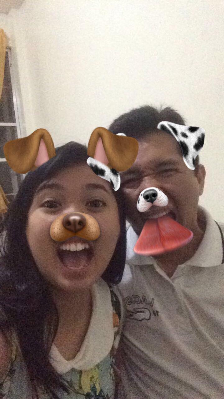 Pinay with dad, using a dog-face Snapchat filter