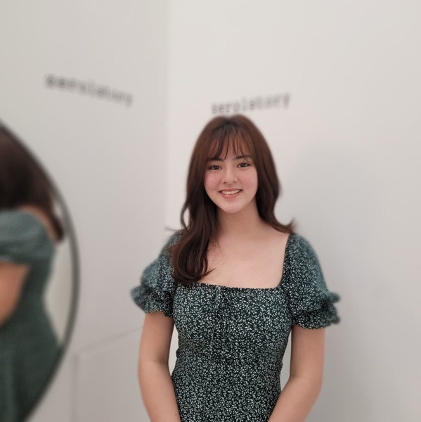Cassy Legaspi sporting a brown hue with layers and wispy bangs