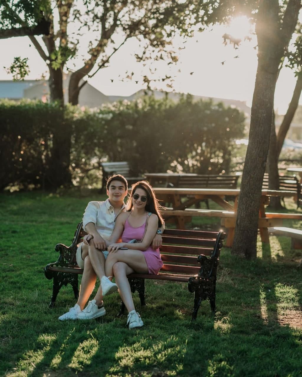 Dominic Roque and Bea Alonzo sitting on a bench in Napa California