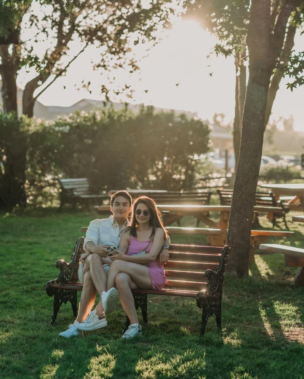 Dominic Roque and Bea Alonzo sitting on a bench in Napa California