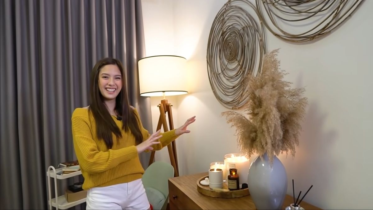 Ysabel Ortega with the Crate & Barrel spiral fixtures in her wall