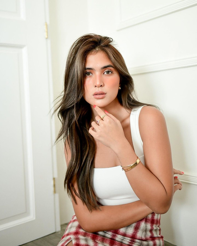Sofia Andres wearing a modern classic outfit