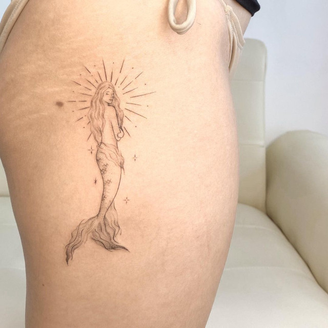 Thigh tattoo design: mythical creature