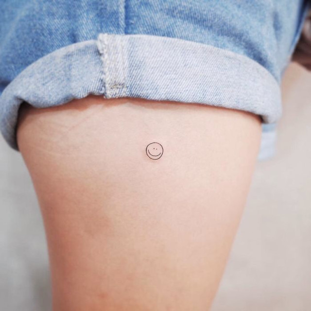 Thigh tattoo design: smiley face