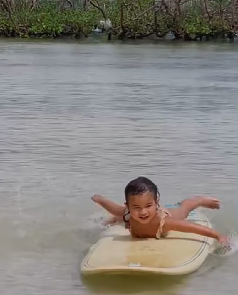 Lilo Alipayo starts learning how to surf