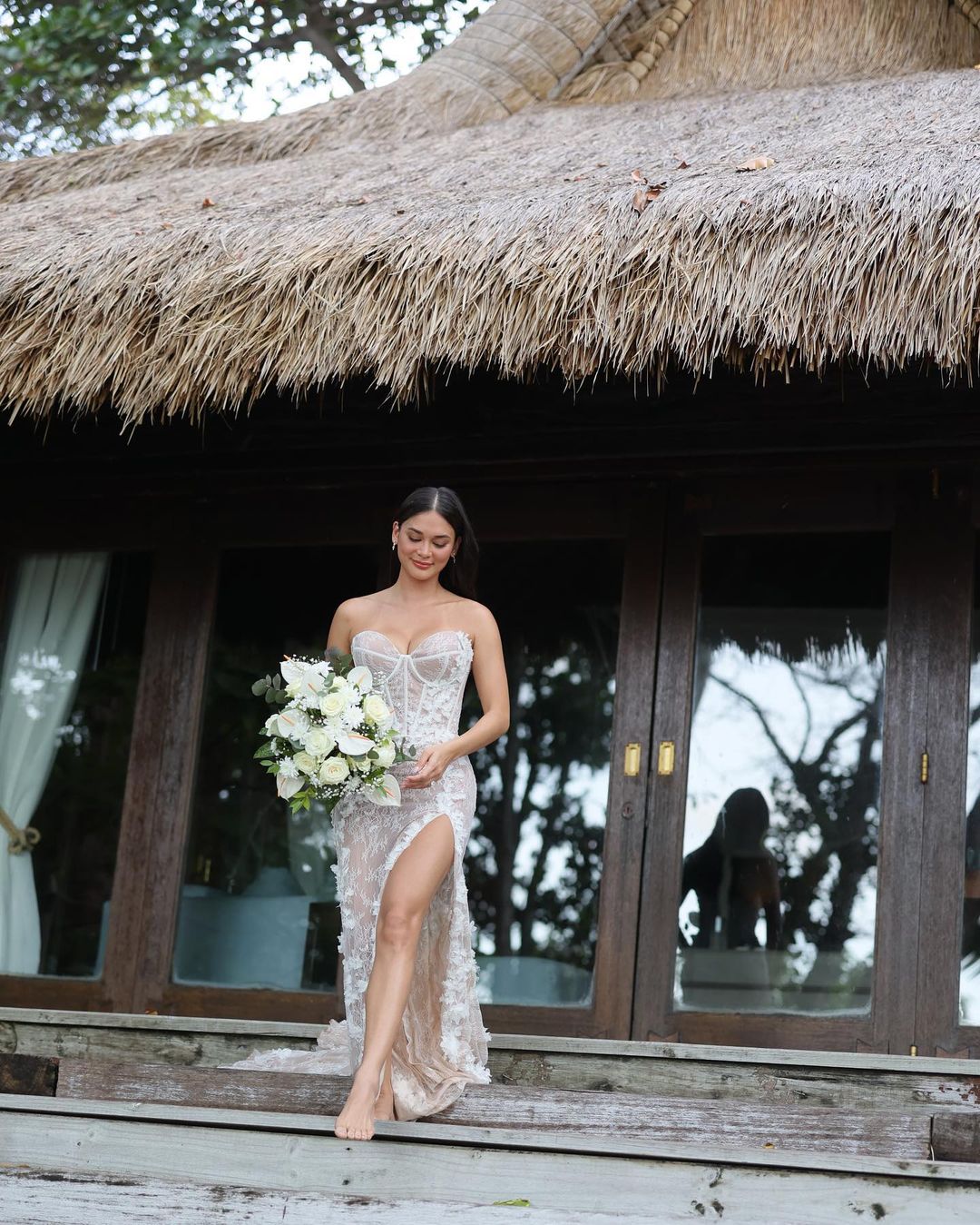Pia Wurtzbach in her wedding gown exiting the villa at North Island, Seychelles