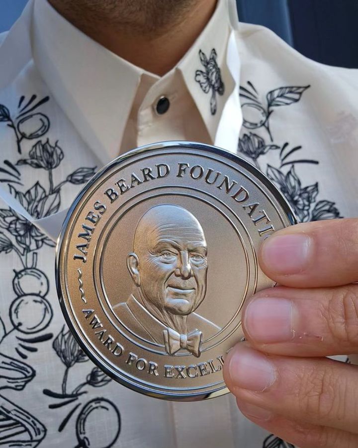 Erwan Heussaff holding his James Beard Foundation award medal