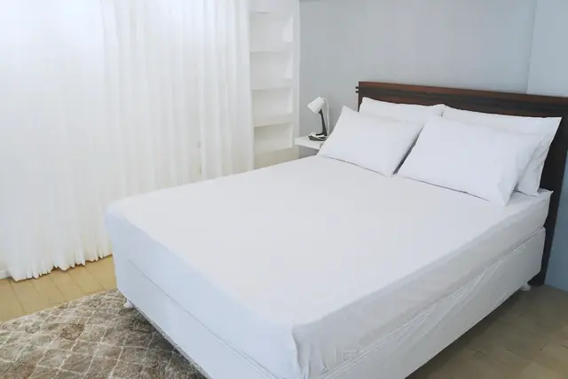 The Sky Loft Airbnb queen-sized bed