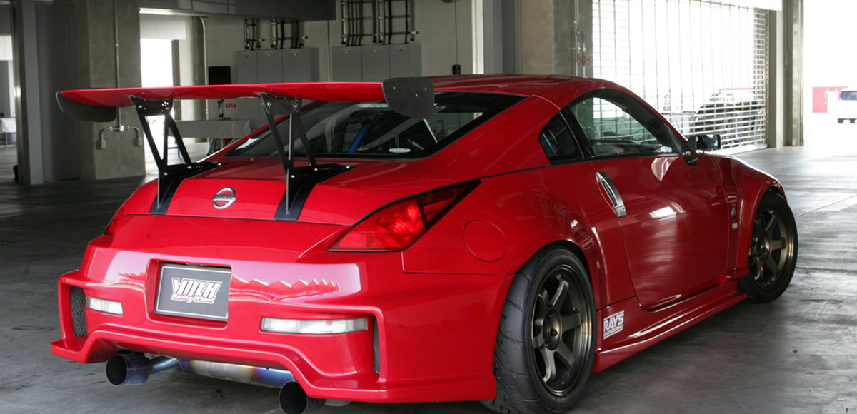Red Nissan car with the TE37 wheels