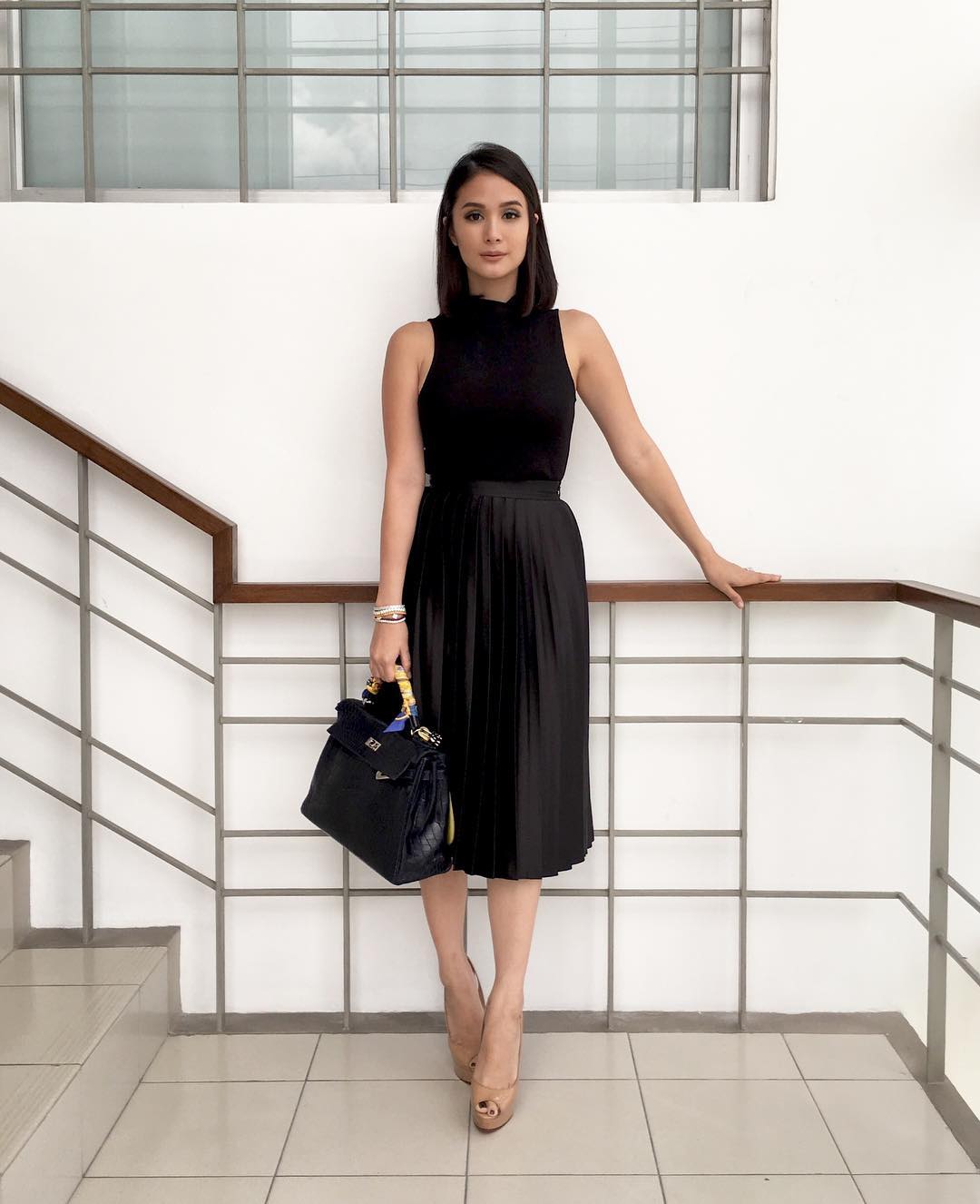 Heart Evangelista seen wearing white pleated skirt, black blazer