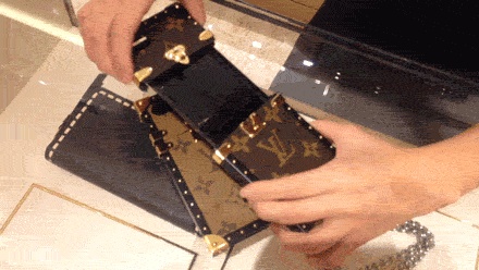 Are The Louis Vuitton Trunk-Inspired Phone Holders Going To Be The 'IT'  Thing?