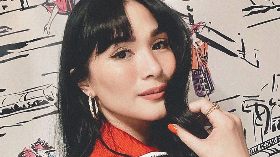 5 Fresh Ways To Style Your Bangs, According To Heart Evangelista