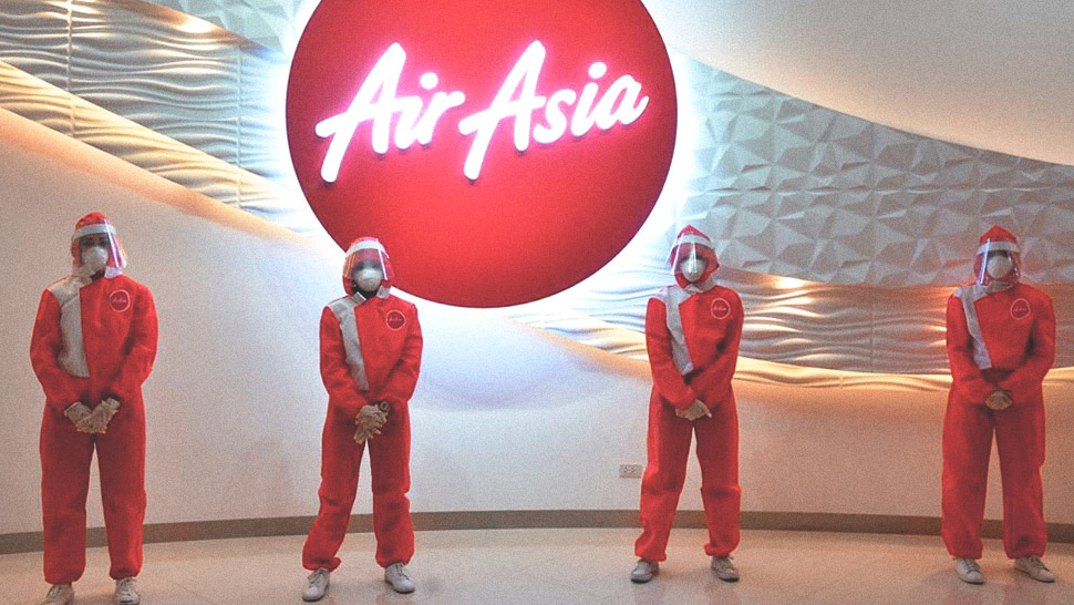 Airasia Just Introduced Red Hot Ppe Suits By Filipino Designer For Its Cabin Crew