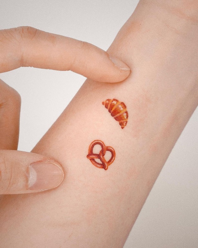 croissant and pretzel tattoo