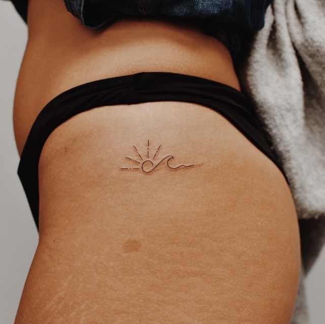 hip tattoo minimalist design: Sun wave