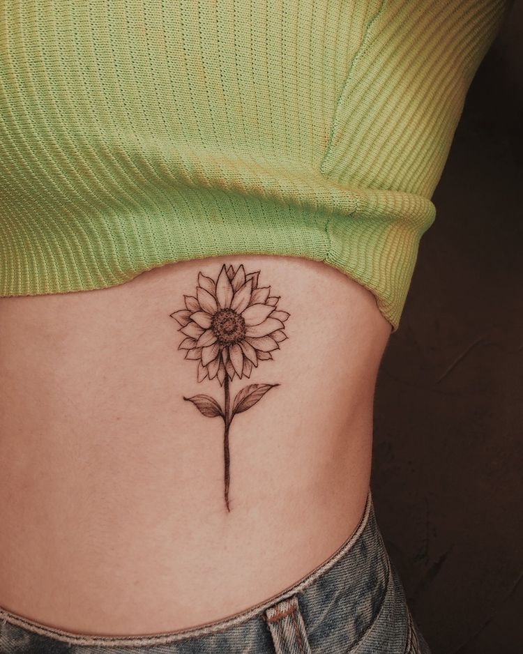 dainty floral rib tattoo ideas