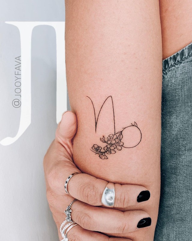 capricorn tattoo on arm