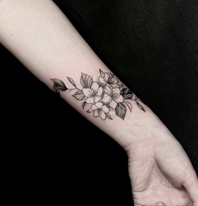 Delicate flowers tattoo on the arm  Tattoogridnet