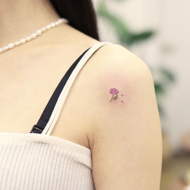 Minimalist flower tattoo on the wrist