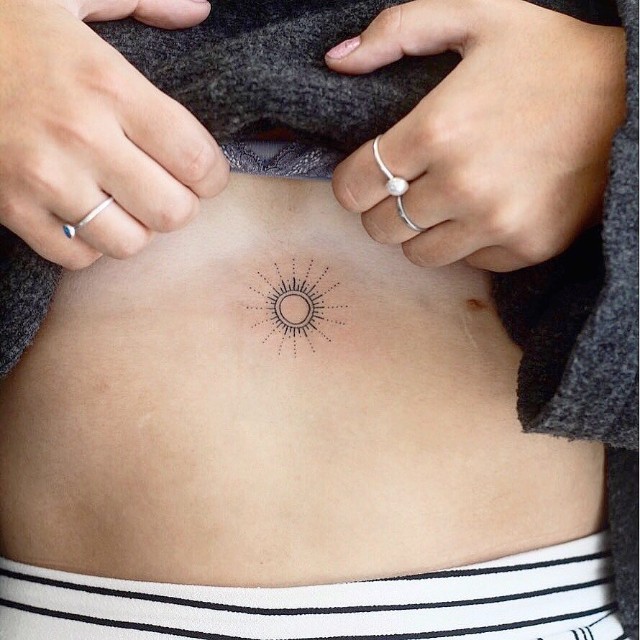 Fine line north star tattoo located on the sternum