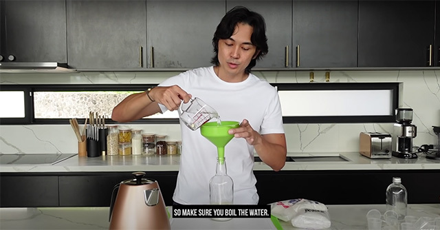 Slater Young pouring the solution to get rid of house ants
