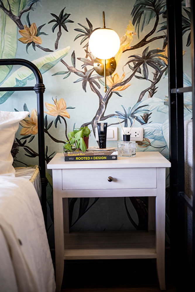 night table in a tropical-inspired bedroom