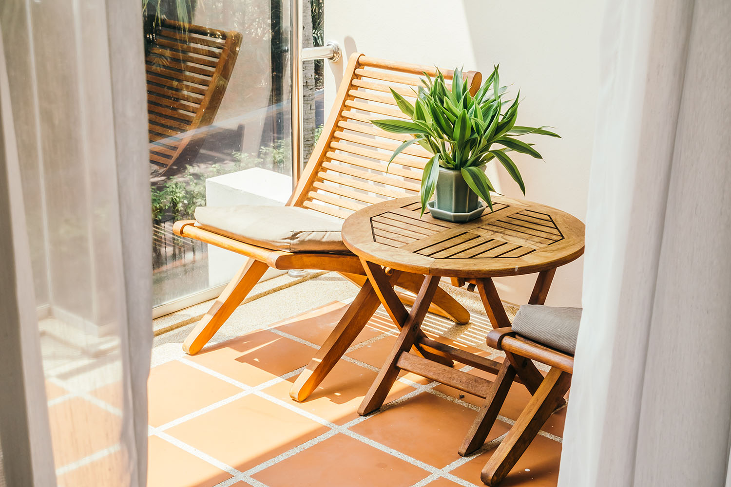 simple terrace design with wooden chairs