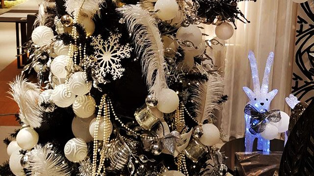 Stressed By The Holiday Rush These Vignettes Can Make You Feel An Urban Style Christmas Tree In Ebony Is Adorned With Glamorous Black Velvet Top Hats And Plush White Silver Feathers Masks