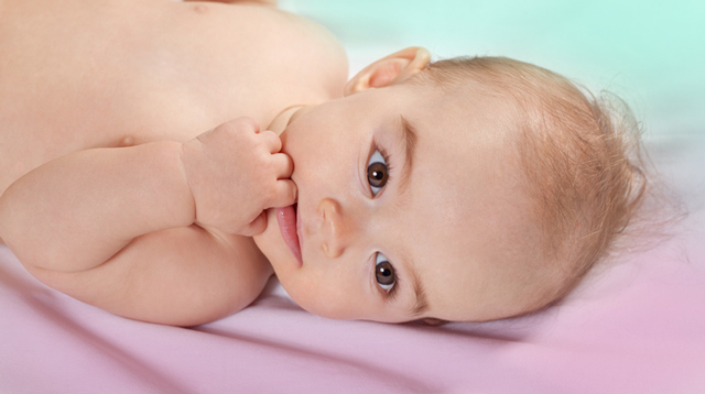 Does Your Baby Love Chewing On His Little Hands? Here Are 4 Possible Reasons Why