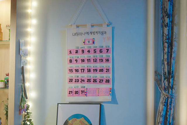 A calendar with pockets containing money