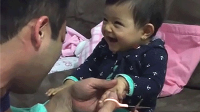 This Made Our Day: Baby Pranks Dad by Pretending to Be Hurt While He Cuts Her Nails
