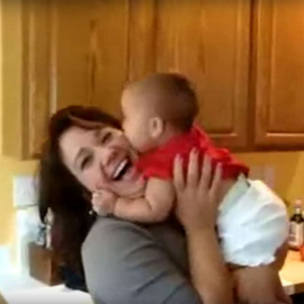 This Made Our Day: Baby Launches a Kiss Attack on Mom