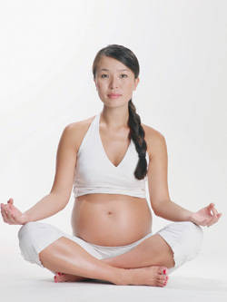 pregnant woman doing pilates