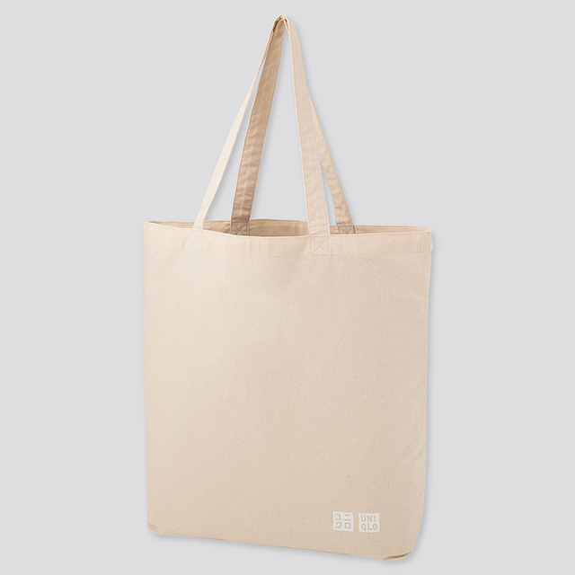Male Hand Holding Parcel Plastic Bag from Uniqlo Japanese Fashion Retailer   Editorial Photo  Image of cheerful pack 174160866