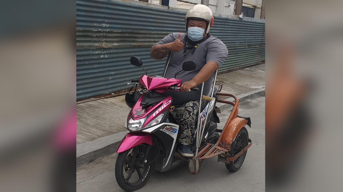 A Yamaha Mio has been transformed into a PWD friendly ride