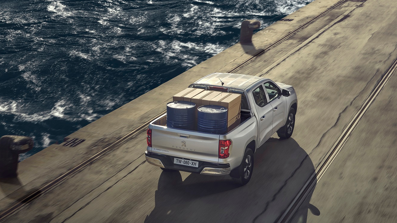 The Peugeot Landtrek carrying a load over a wharf
