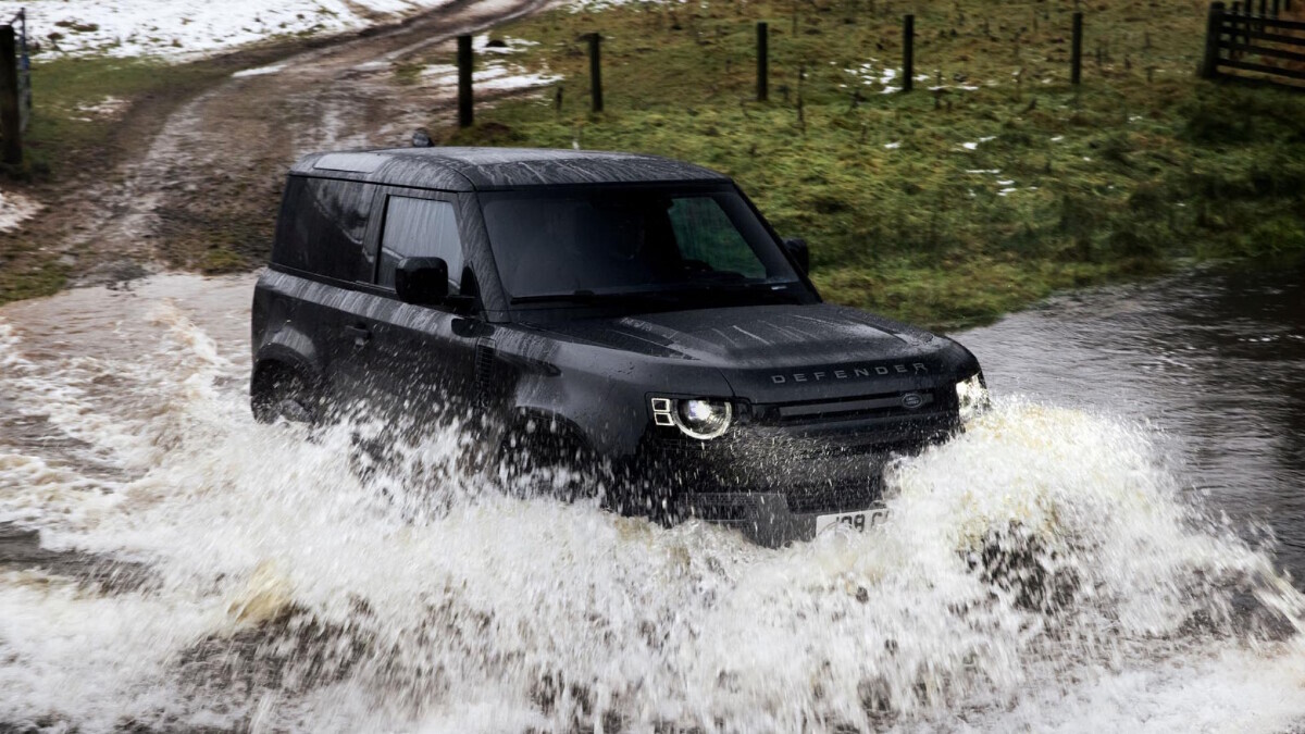 The Land Rover Defender V8 driving through water